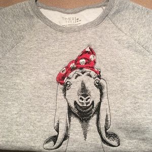 Embroidered goat sweatshirt.